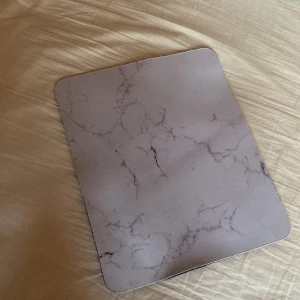 Musmatta  - En oanvänd musmatta i måtten 26X21cm 