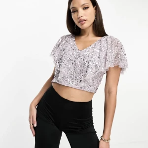 Paljettopp  - Ljuslila paljettopp från asos. Helt oanvänd, har forfarande prislappen kvar.  Orginalpris: 859kr.