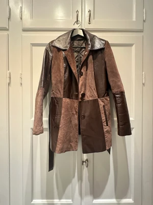 Brown leather coat  - The coat has never been worn, it has a detachable inner linening, perfect for wither fall or autmn. 