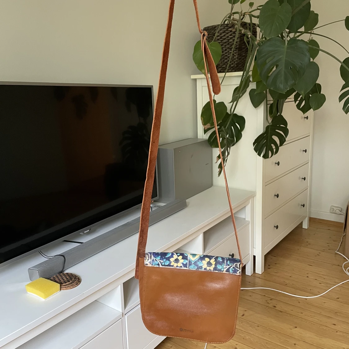 Small leather bag with a long shoulder strap - 90