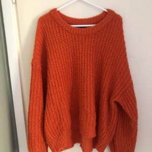 orange knitted jumper