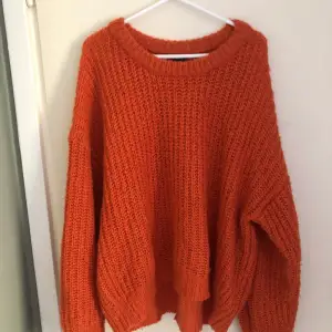 orange knitted jumper