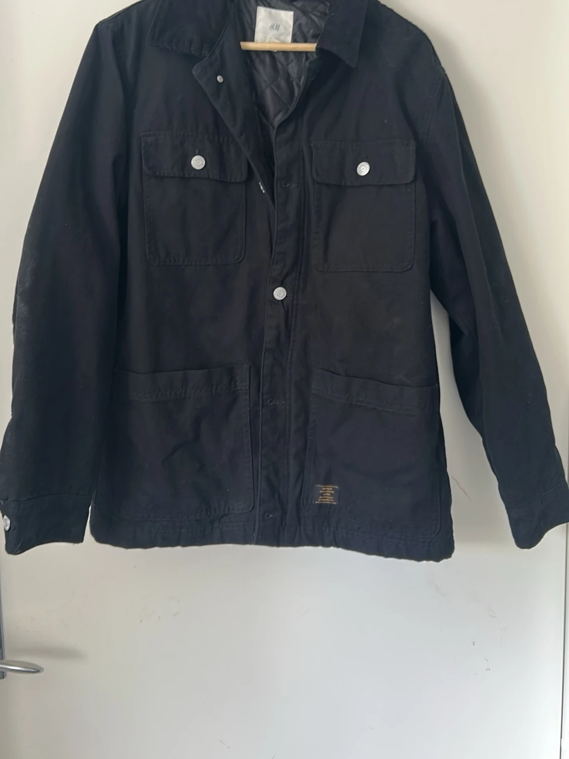 Svart jacka från H&M med fickor
