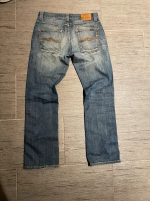 Nudie jeans Slim Jim - Nudie jeans | Slim Jim | 100% organic cotton         Size W33 L32 | Very nice fades | Contact me for more info or photos! Come with offers!