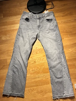 Zara flared jeans grey W32 L32 - Clean grey flare jeans from Zara. Trendy flared fit with a nice silhouette perfect for a modern streetwear look.  * Size: W32 L32 * Fit: Flare / bootcut * Condition: (add condition) * Color: Grey * Comfortable denim  Nice statement piece, easy to style with sneakers or boots.  Fast shipping. Open to offers.