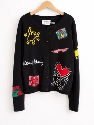 Svart cardigan Keith Haring x Alice + Olivia -  Svart cardigan med färgglada Keith Haring-inspirerade tryck. Mittenknappen saknas. Orginalpris:4000kr 