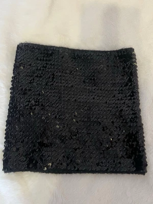 Paljettopp  - Bandeau paljettopp i stretchigt material