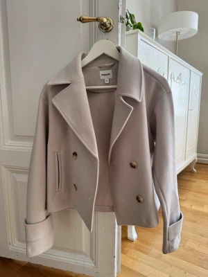 Beige kappa - Fin kappa som använts någon gång