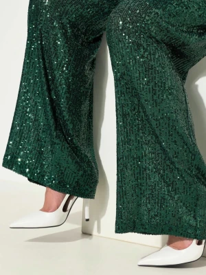 Gröna paljettbyxor Ane Mone strl 36 - Mörkgröna byxor från Ane Mone, täckta med glittriga paljetter. Modellen är Palmer Trouser med breda, raka ben och hög midja. Perfekta för dig som vill ha ett statement-plagg som verkligen syns.