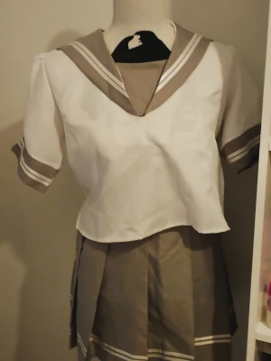 Aqours uniform - Only shirt and skirt! Has flaws that I will show! Can discuss price. I can also trade. The flaws are from the past owner, not me.