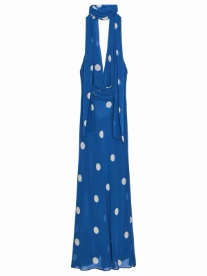 Blå lång prickig halterneckklänning - Snygg blå långklänning med vita prickar och halterneck med scarfdetalj. Klänningen har en lös passform, öppen rygg och är ärmlös, perfekt för sommarens alla tillfällen. Tillverkad i ett lätt och luftigt material som ger ett elegant fall. Aldrig använd endast testad