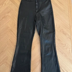Zara faux leather pants  - Very good condition (button paint is scuffed off but pants are like new) Cropped with flare leg  Size M but fits small