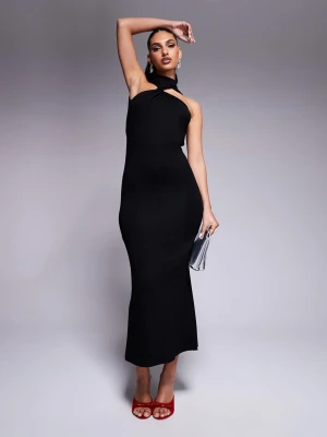 Svart långklänning med öppen rygg - svart långklänning med halterneck och öppen rygg. Använd 1 gång. Stl 36