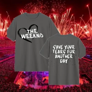 The Weeknd tee (OSLÄPPT MERCH) - Grå t-shirt med coolt svart hjärta och texten 'THE WEEKND' på framsidan. Baksidan har trycket 'SAVE YOUR TEARS FOR ANOTHER DAY' i vit text. Perfekt för fans av The Weeknd och snygg till jeans eller shorts. OSLÄPPT MERCH