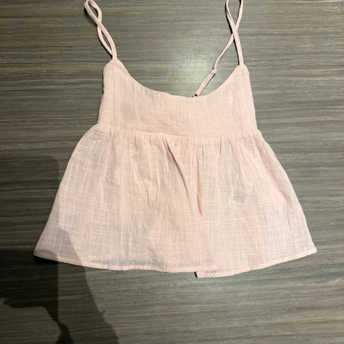 Ljusrosa linnetopp med rosett från Nelly