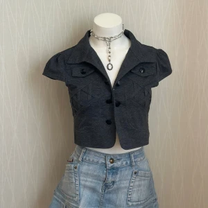 Cap sleeves bolero  - One button is missing 