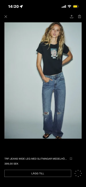 Blå wide leg jeans med slitningar - Snygga blå jeans från Zara  med wide leg och slitningar på båda knäna. Medelblå tvätt, klassisk femficksmodell och medelhög midja. Jeansen har raka ben och är tillverkade i jeansmaterial med en cool, avslappnad vibe.