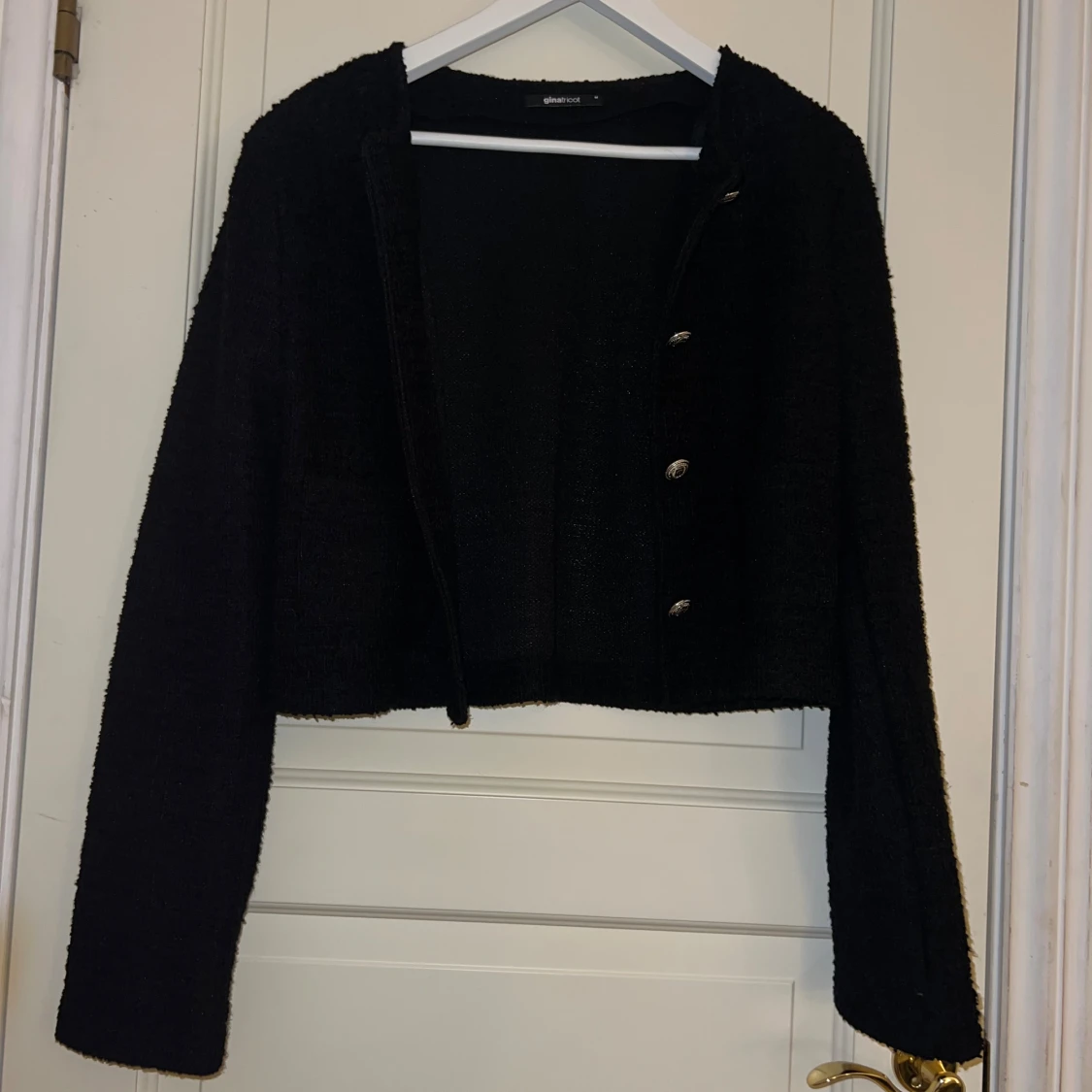 Svart kofta från Gina Tricot