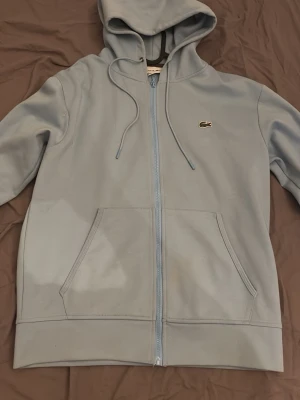 Lacoste Hoodie Ljusblå - Jätte bra skick