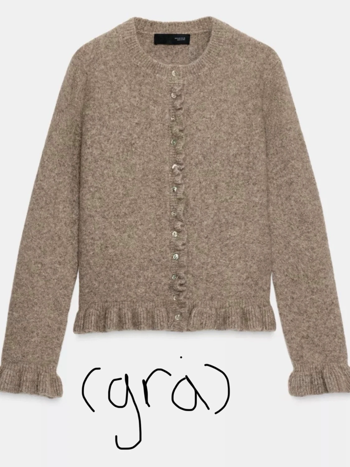 Grå kofta med volangkant 