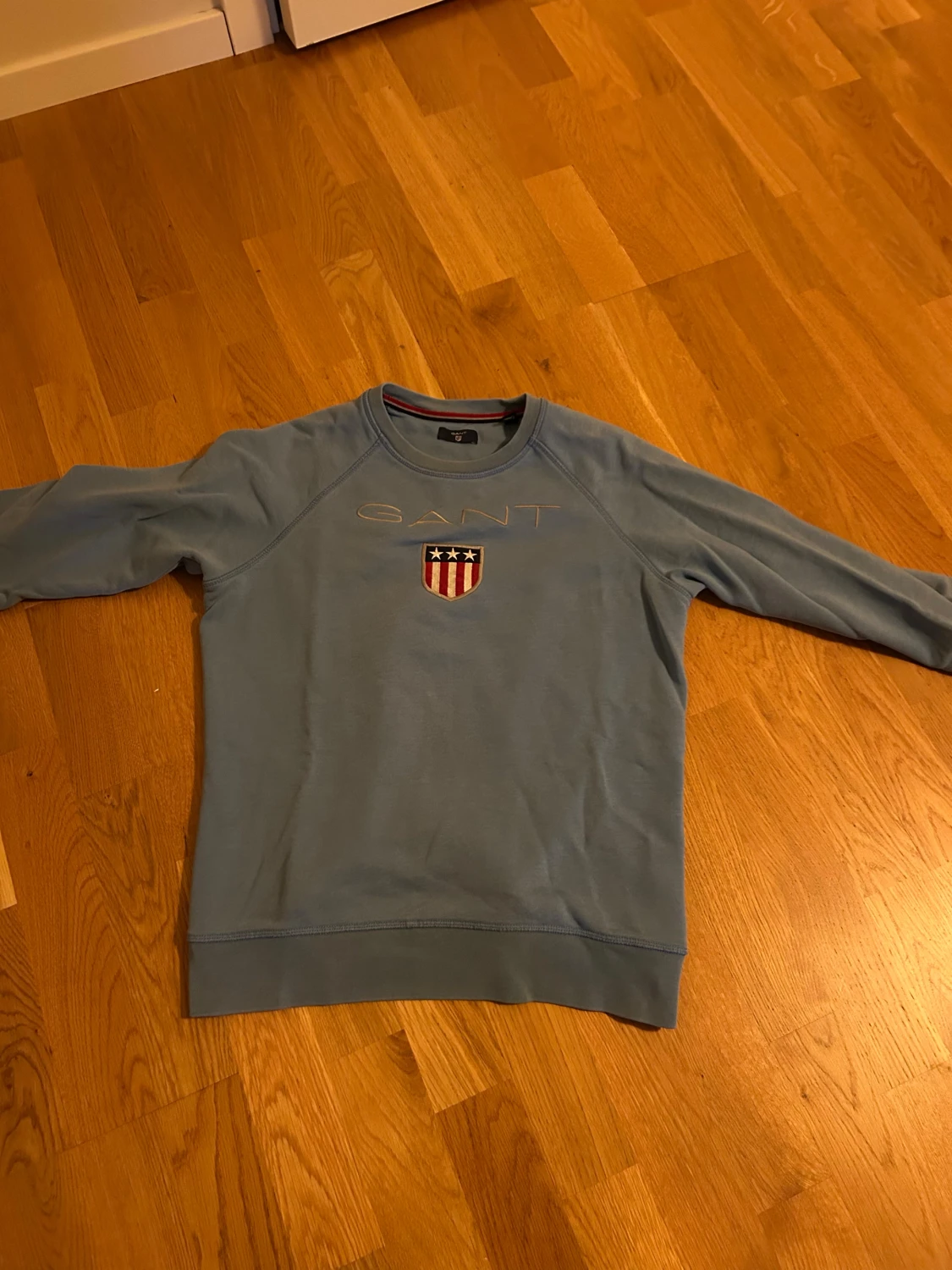 Ljusblå tröja gant