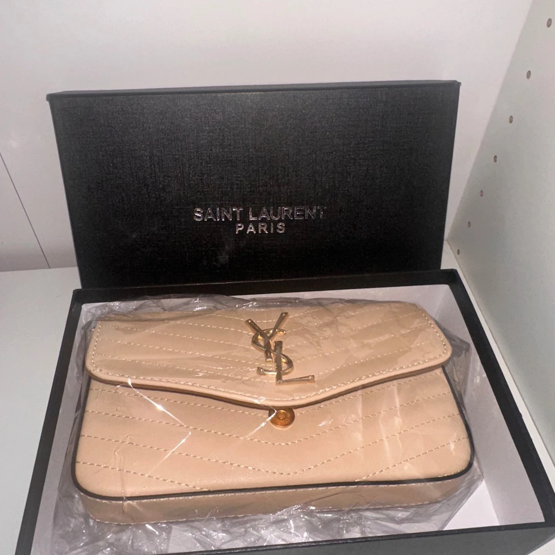 Beige quiltad YSL handväska i skinn - 1