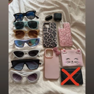 Allt  - Säljer 7 olika solglasögon, tre mobilskal leopard och glitter (iphone 12) rosa rosett (iphone 16 pro), rosa söt plånbok och ett ideal of sweden airpods skal. Går självklart att köpa enstaka saker. 