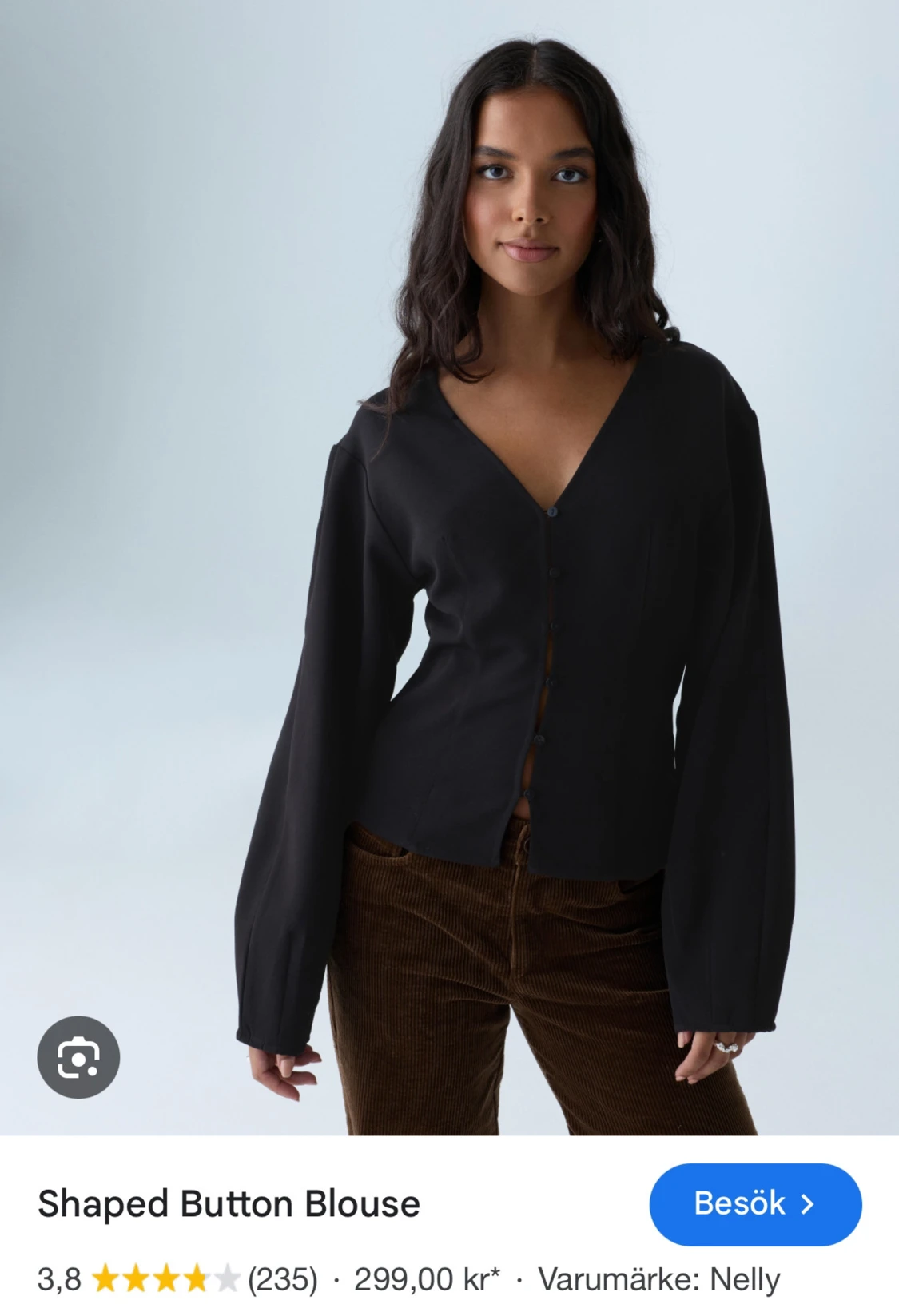 Svart blus med knappar från Nelly
