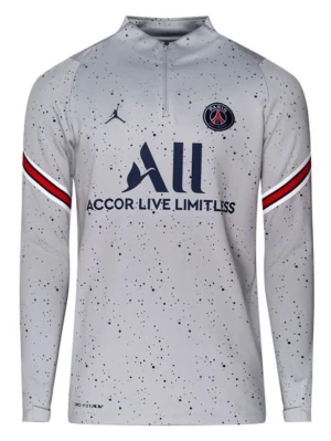 Psg tröja  - Bilden visar en långärmad träningströja från PSG med prickigt mönster och dragkedja vid halsen, inte en sko.