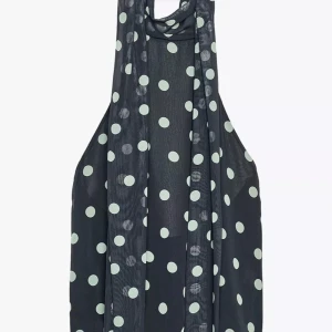 Svart prickig ärmlös halterneck topp - Super snygg topp med öppen rygg och knytning runt halsen, perfekt elegant festtopp. Säljer då den är för stor.