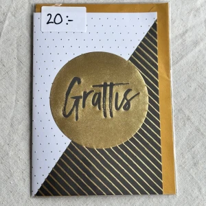 Gratulationskort  - Snyggt och stilrent grattiskort med guld- och svartdetaljer. Medföljer kuvert samt den är kvar i sin ursprungliga förpackning. Insidan består av helt vita blad så plats för mycket text 