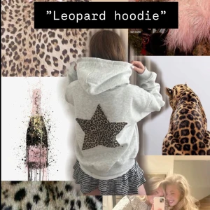 Grå hoodie med leopardstjärna - Grå hoodie med en cool stjärna i leopardmönster på ryggen. Oversized fit med breda muddar och mjukt material!. Perfekt både till vardags och till skola, jobb mm! Hoodien är i stl S! Bara höra av er vid några frågor! 