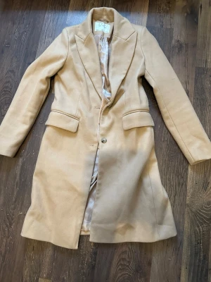 Beige kappa - Köparen står för frakten!