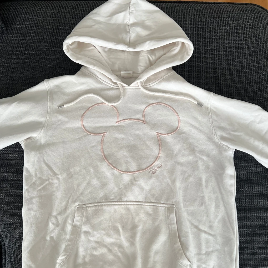 Krämvit hoodie med Disney tryck