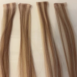 Hairtalk löshår - 24 slingor hairtalk PLUS i en kall blond färg. Håret är i äkta människohår. Använda ca. en vecka så i väldigt fint skick. 40cm långa.  Tejp för att fästa håret ingår inte