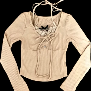 Coquette - Coquette long sleeve. Only tried on but never worn, so no defects. Also I’m willing to discuss the price. Size S