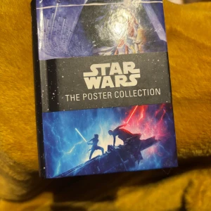 Star Wars mini poster book - Unused. Bought to be a gift but never gave it away.