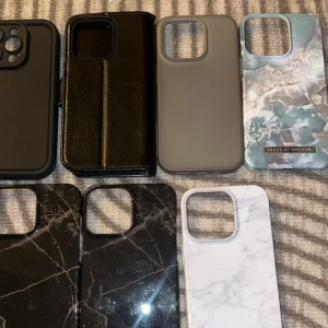 Fodral och skal för mobiltelefon - Säljer en samling av mobilskal och fodral i olika stilar och material. Inkluderar marmor- och stenmotiv samt ett svart läderfodral. Perfekt för att ge din telefon ett nytt utseende. Olika model.
