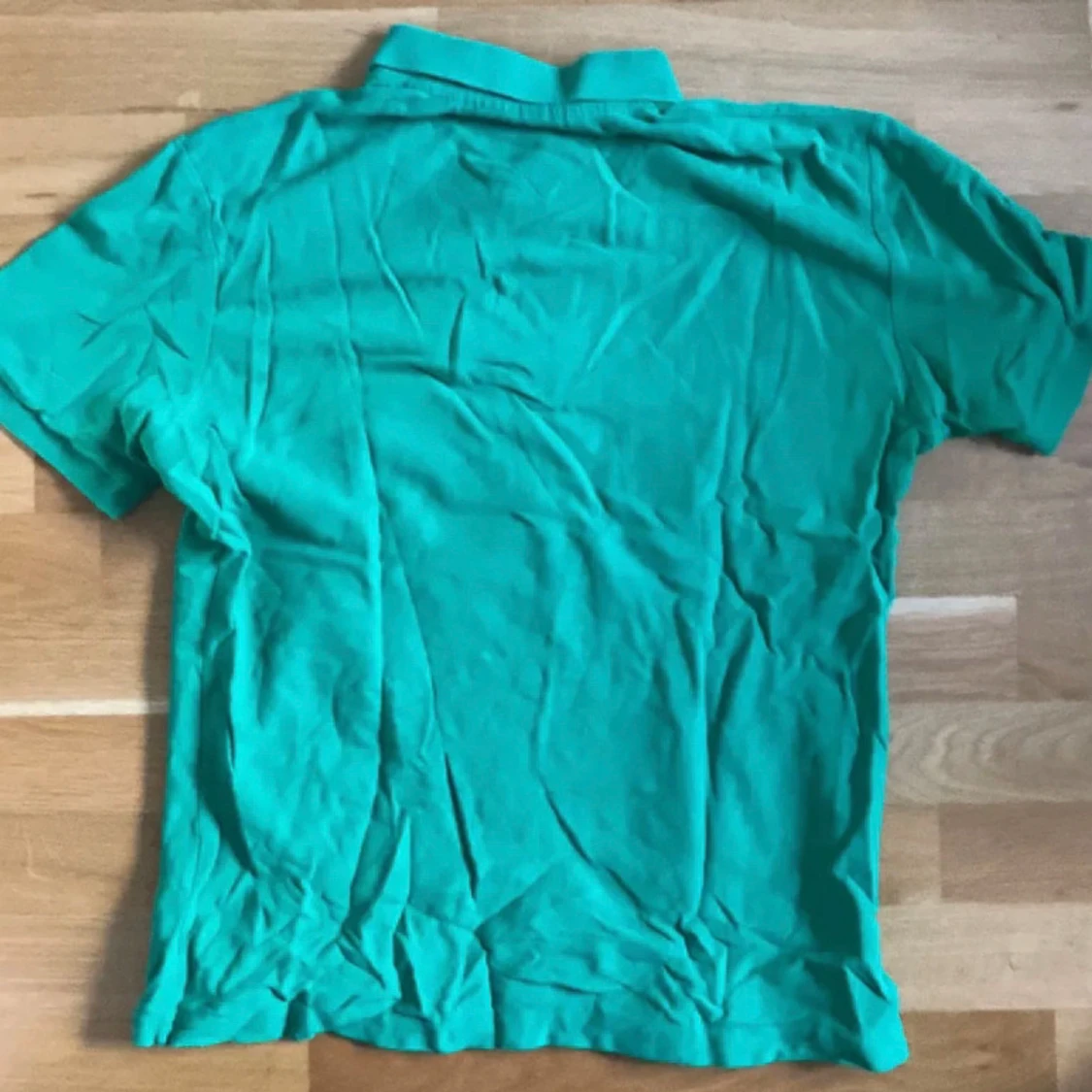 Grön pikétröja från Gant - 90