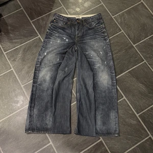 Paint Splattered Baggy Flared Jeans - Size 33/22 Waist: 41cm Length: 102cm Leg opening: 33cm 