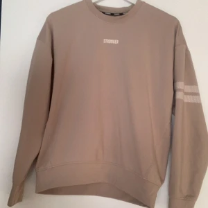 Beige tröja - Skön beige tröja från stronger i storlek s