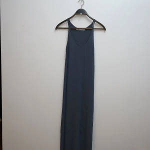 Grey maxi dress  - The dress cuts to the calves and shapes the body well.