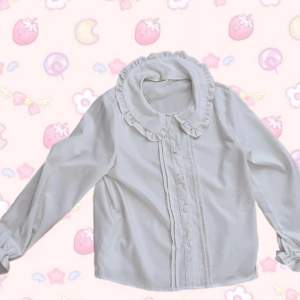 Kawaii button up peter pan collar shirt. Comes with a pink lace. Looks very good with the blue cardigan on top 💕 Originally from aliexpress. In perfect condition