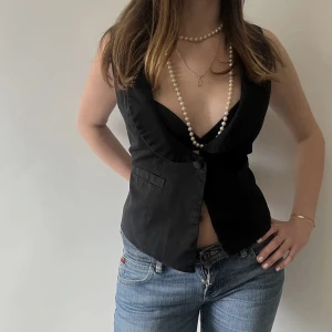 Kostymväst  - Kostymväst i svart färg 