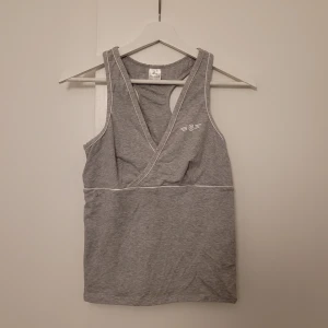 Träningslinne - Aldrig använd.  Smalare rygg och fin format på framsidan.