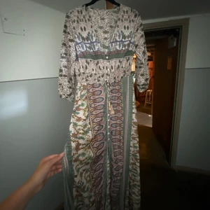 Långklänning - Vacjer långklänning i stolek S (skulle jag säga)