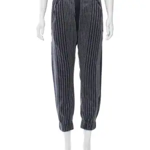 Navy and grey Zero + Maria Cornejo Eka Rikki striped relaxed fit jogger pants with elasticized waist band, dual slit pockets and elasticized cuffs. Linen/Silk Blend Size 0
