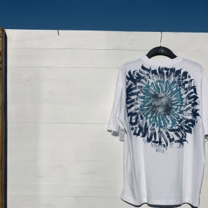 Hand-painted calligraffiti T shirt! - The T shirt itself is brand new from H&M. The paint is fabric paint which is whashable at 40 degrees.