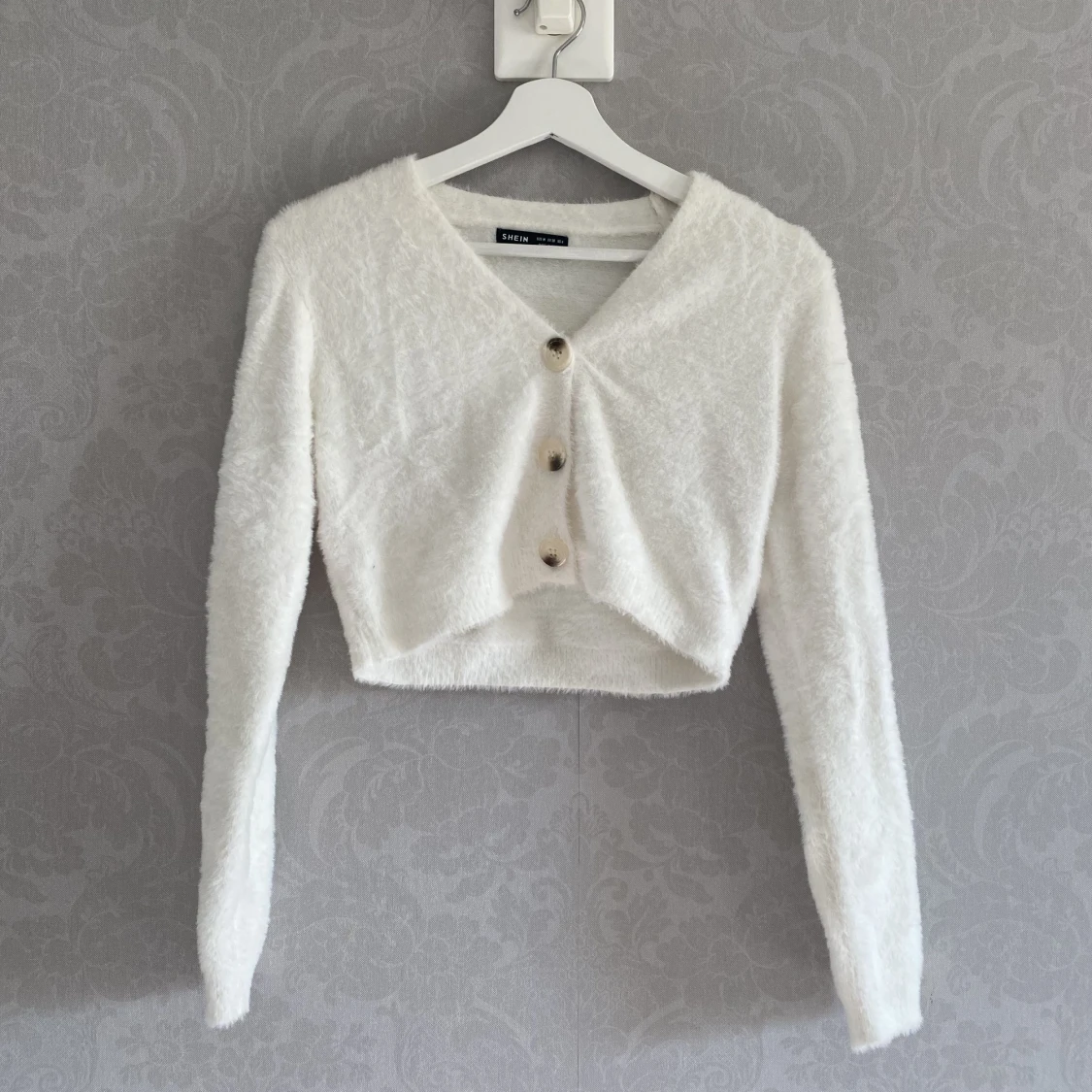 Croppad topp med knappar 