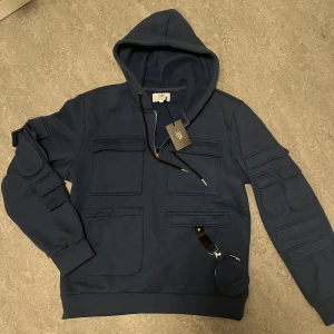 Sixth June multi pocket cargo Hoodie - Helt oanvänd, tag sitter fortfarande på. Inga defekter. Ordpris~1000kr
